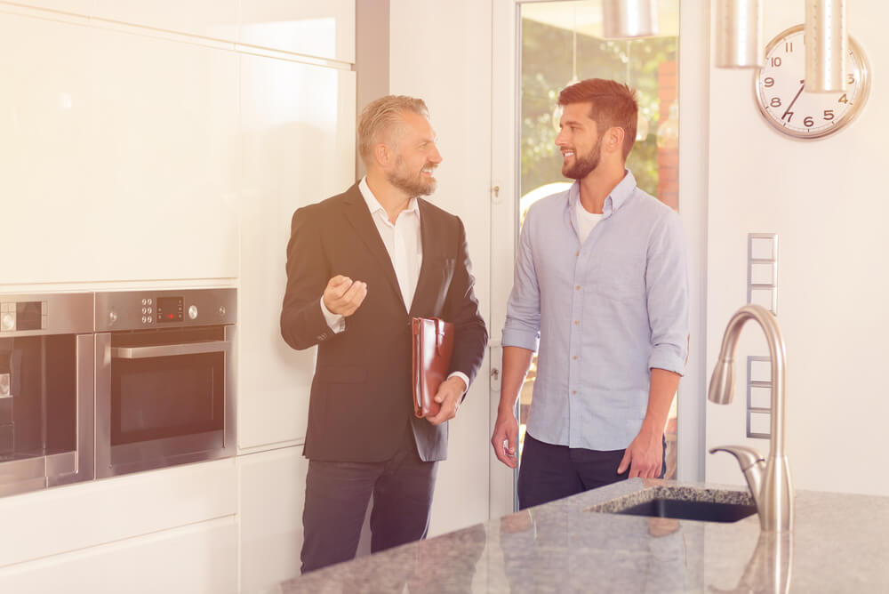 A potential renter doing a thorough property inspection with real estate agent