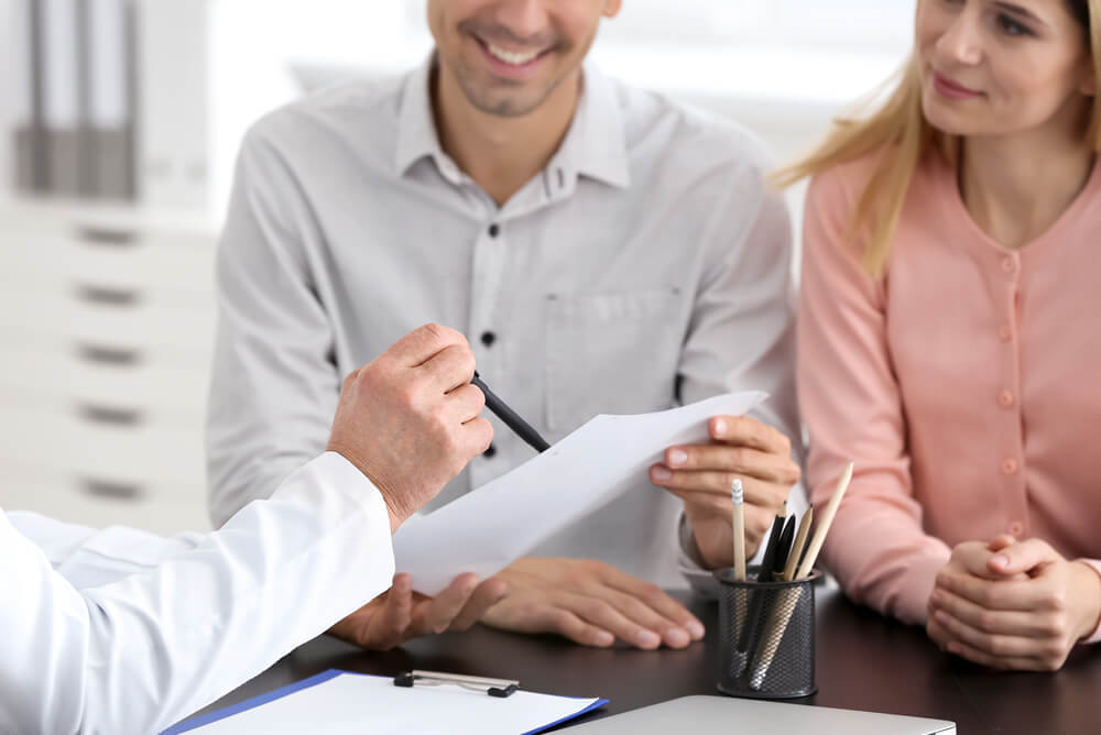 doctor discussing private health insurance waiting periods with patients