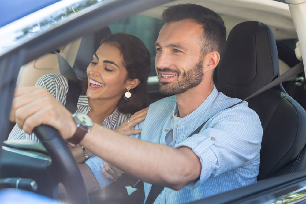 a man and woman in the car