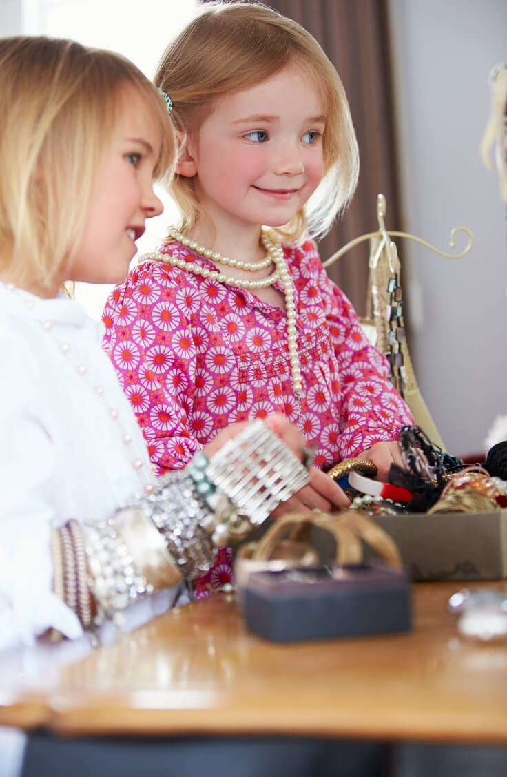 Young girls playing with jewellery