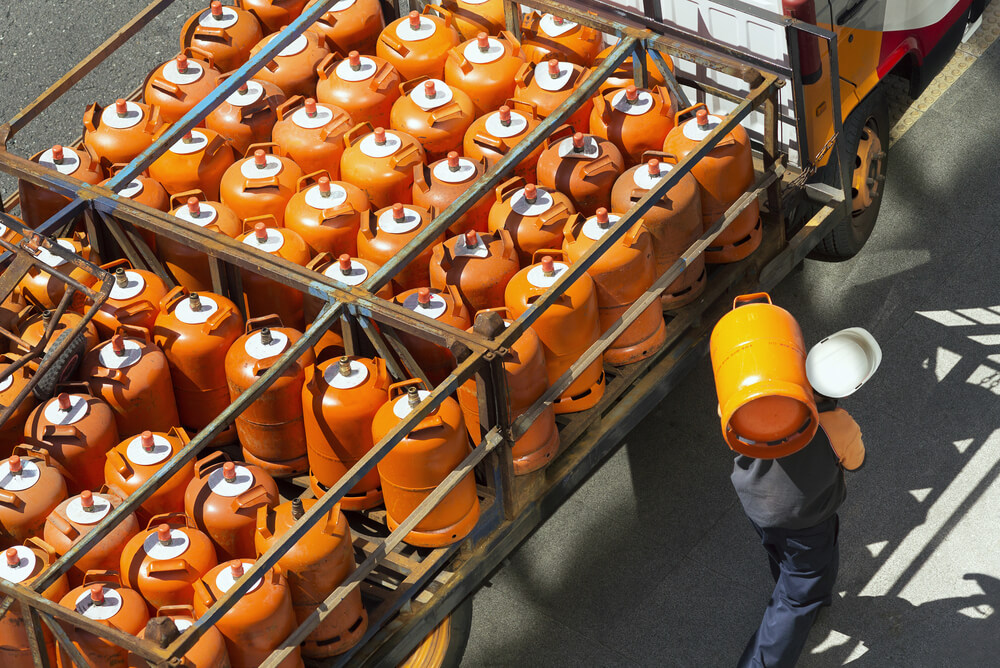 man delivering lpg cylinders