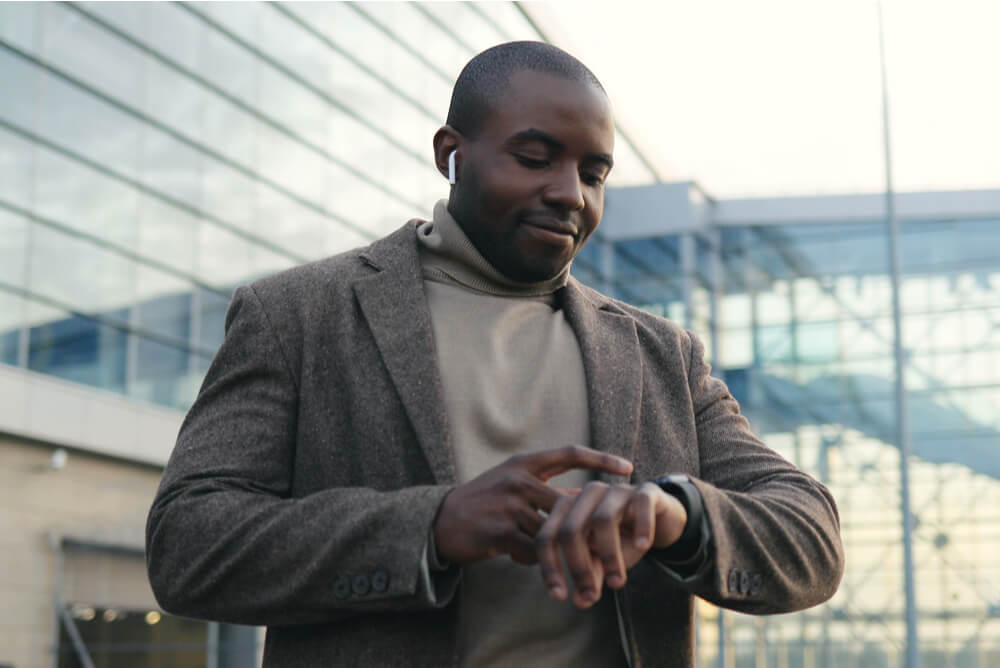A man looking at his watch.
