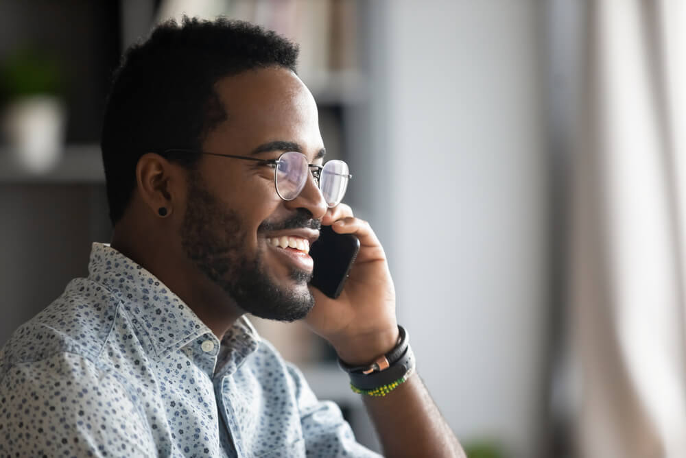 man checking flood insurance coverage over phone