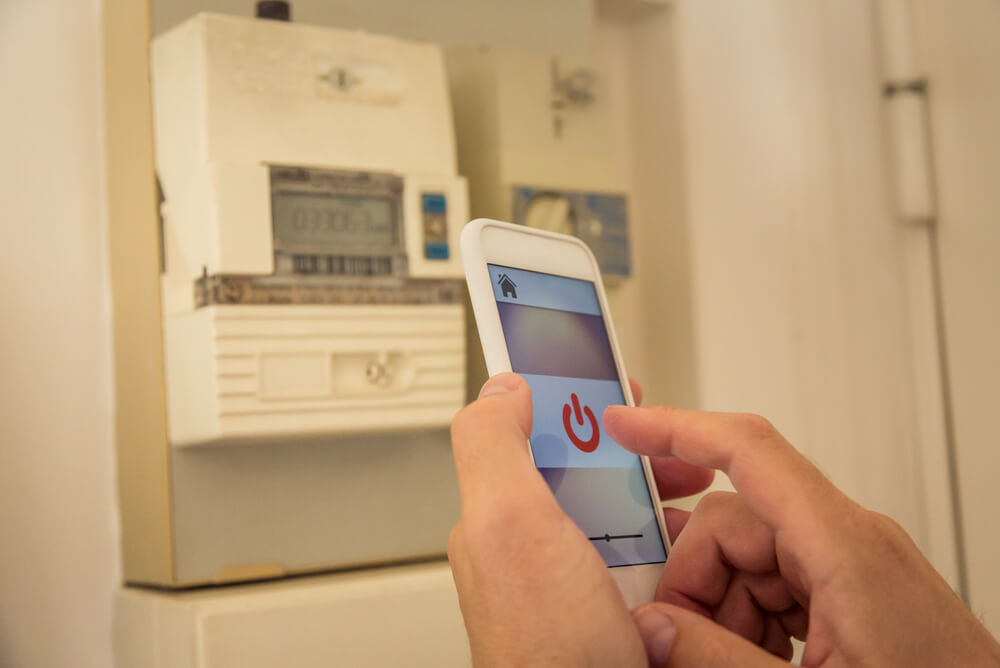 person using app with smart meter