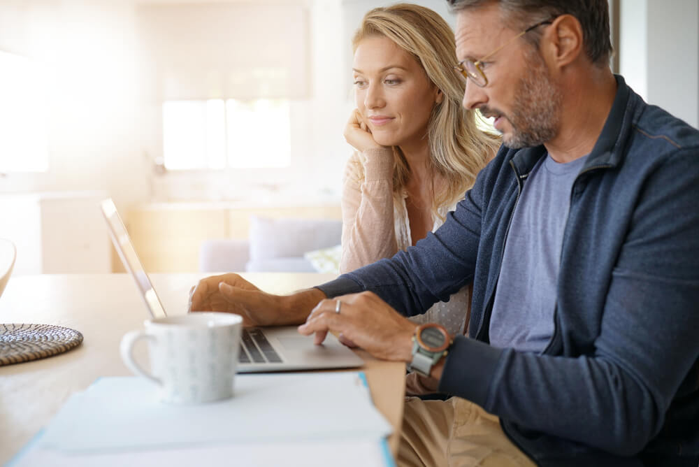 a mature couple switching energy providers online