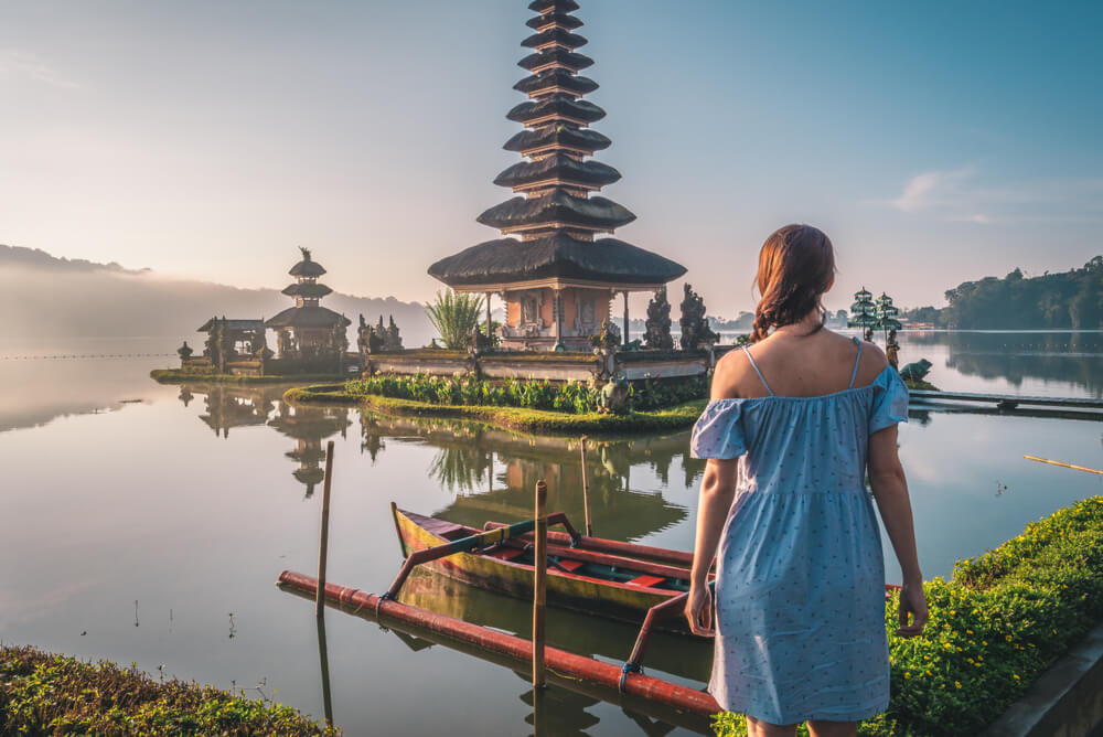a young woman visiting Pura Ulun Danu Bratan Temple