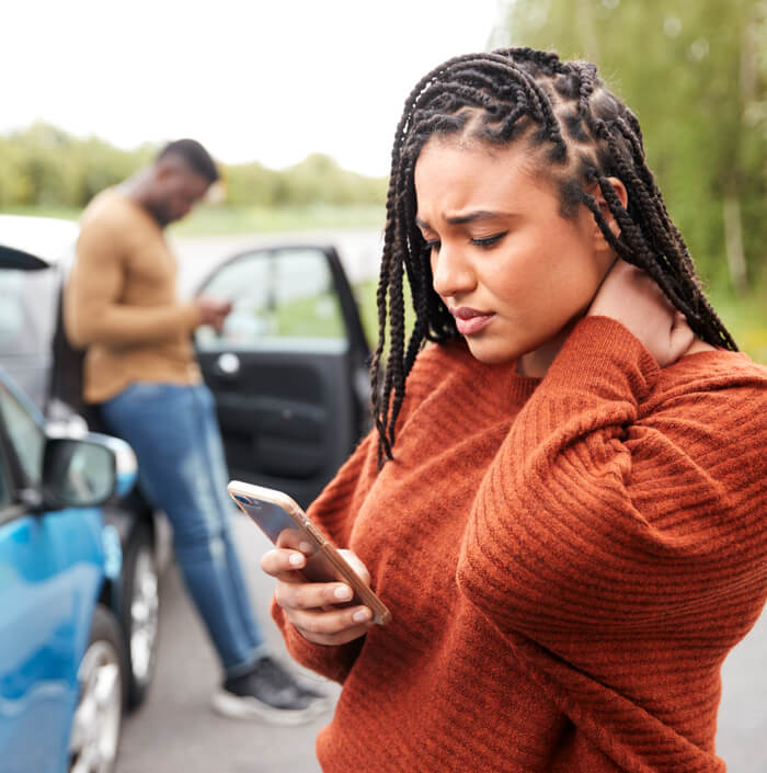 a woman on the phone following a car accident