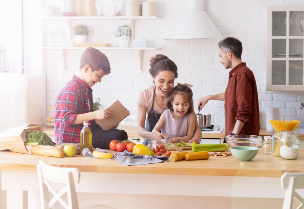 a family cooking dinner in the kitchen
