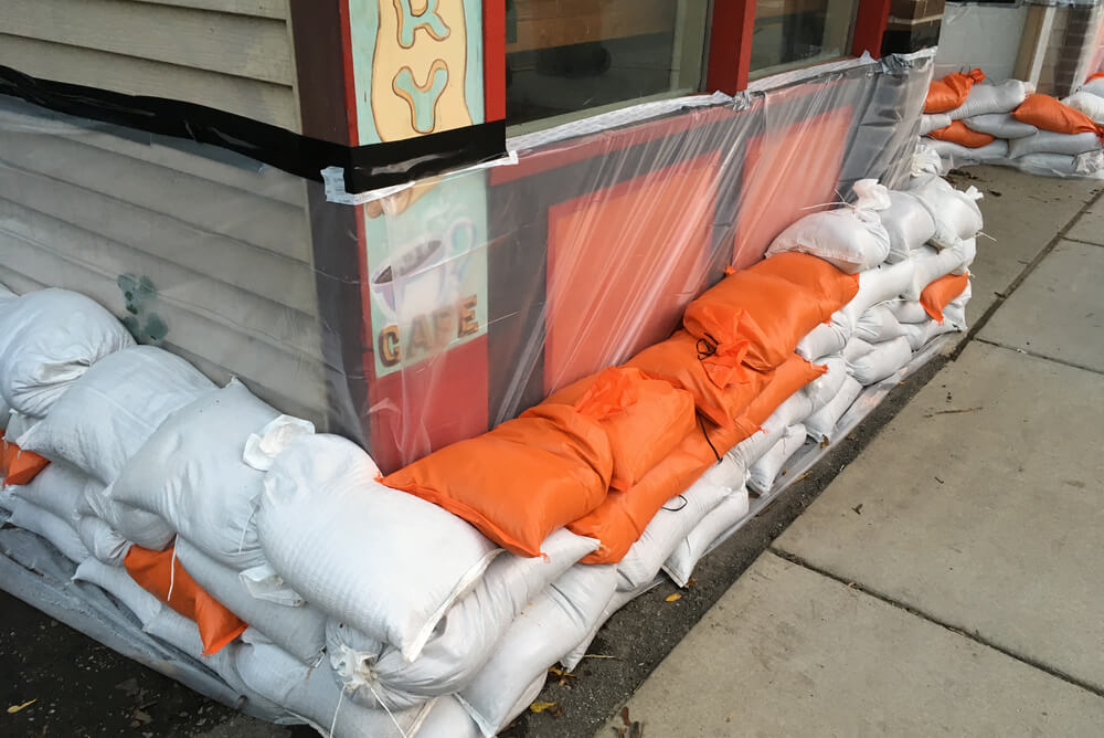 a cafe preparing for a flood covered by business insurance