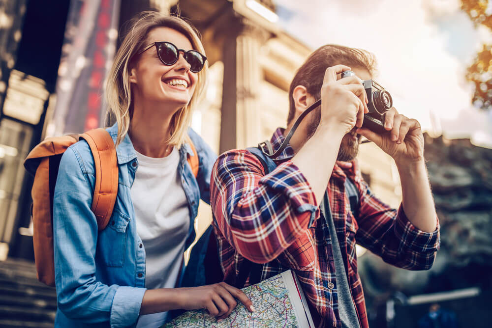 a tourist taking a photo with his travel buddy
