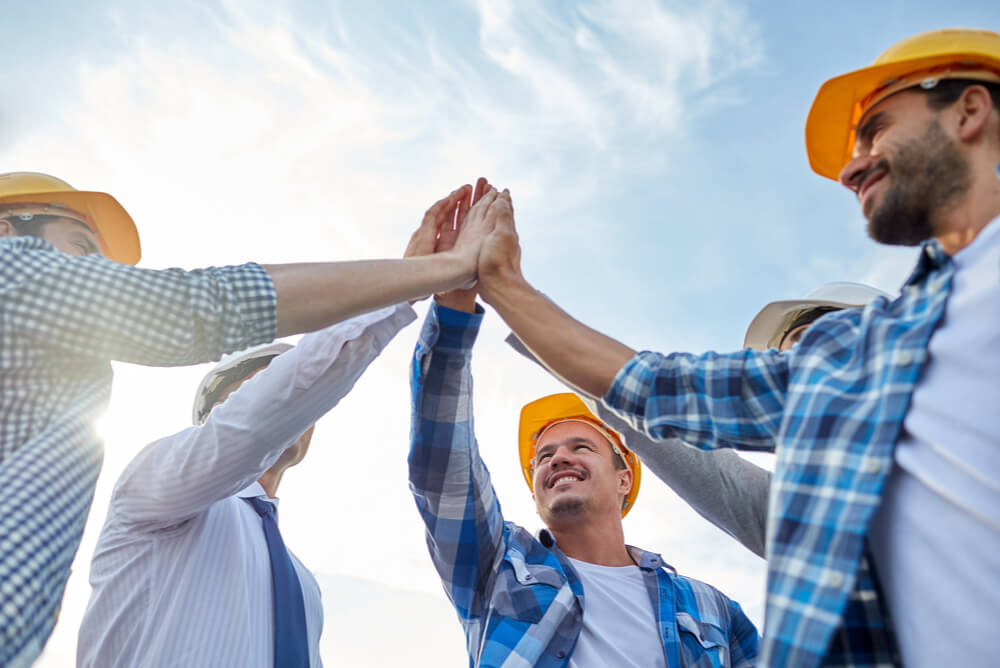 construction site workers carefree with income protection insurance