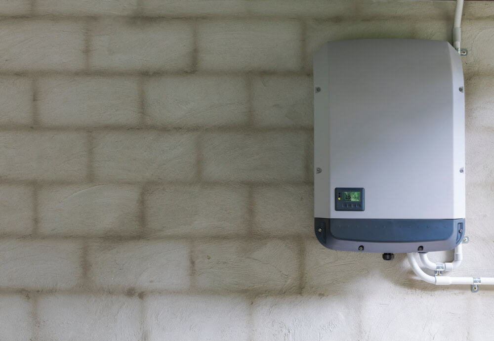 a home solar battery system on a brick wall