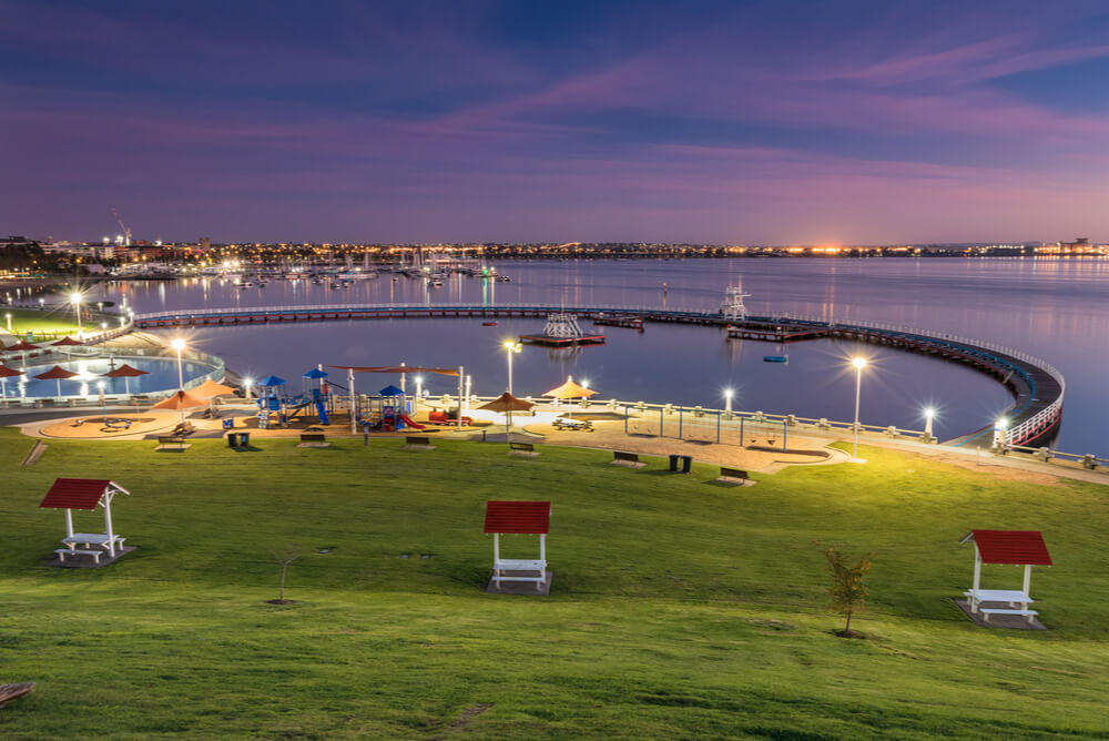 Dusk view of the city of Geelong lit up with electricity representing cheapest electricity Geelong