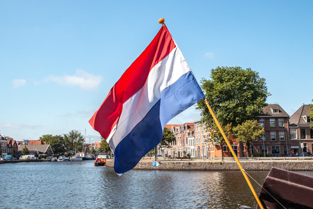 The Netherlands flag next to Spaarne in Haarlem