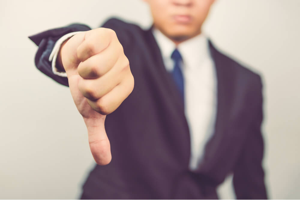 Business man show thumbs down