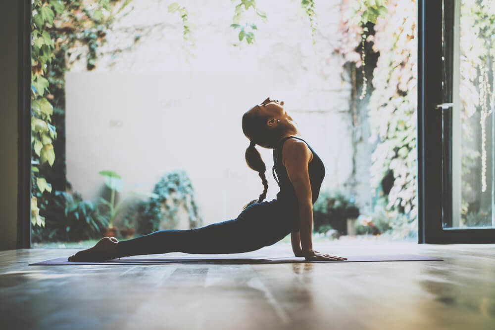 Woman is a yoga pose